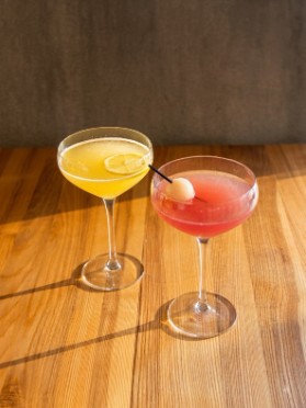 Two cocktails on a wooden table